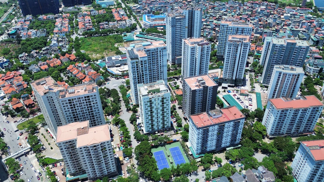Aerial photography showcasing high-rise buildings in Hanoi, Vietnam, highlighting urban life and architecture.